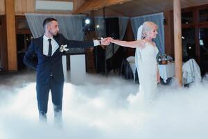 the wedding of the bride and groom in an elegant restaurant with great light and atmosphere. Heavy smoke photo