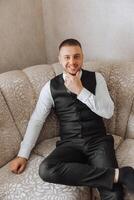 Portrait of smiling successful Caucasian man in formal suit, posing in room, happy young male boss or CEO looking at camera, showing confidence and strength, leadership concept photo