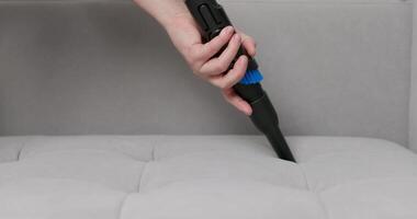 Hand Using Brush Attachment on Vacuum Cleaner video