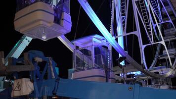 Close up spinning Ferris wheel at night video