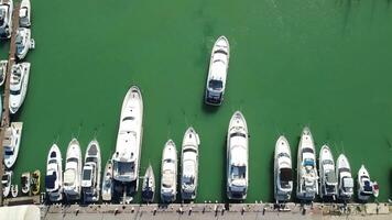 Aerial panoramic view of Balaklava landscape with boats and sea in marina bay. Crimea Sevastopol tourist attraction. Drone top view shot of port for luxury yachts, boats and sailboats. video
