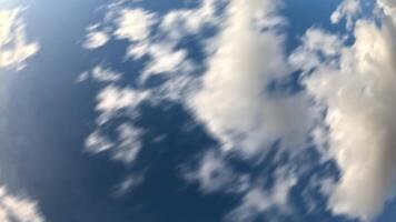 Timelapse fluffy Cumulus clouds moving in bright sunset. Abstract aerial nature summer ocean sunset, sea and sky view. Vacation, travel, holiday concept. Weather and Climate Change video