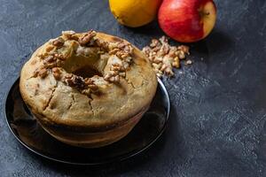 Wet walnut, orange and apple pudding. photo