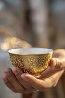 AI generated Close-up Person Holding a Small Arabian Coffee Cup, Immersed in the Rich Aroma of Tradition photo