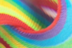 Abstract blurred background of rainbow stripes of fabric. photo