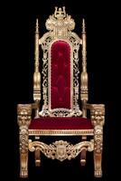 Red royal chair isolated on black background. Place for the king. Throne. Tsar's chair. photo