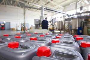 Plastic containers with lids on the background of chemical production. photo