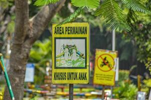 signboard with the words Special children's play area photo