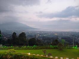 Beautiful view with misty of Salak Mountain, Puncak Bogor Indonesia. photo