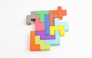 Logical thinking and problem solving problem solution creative business concept, wooden puzzle geometric block shape. photo