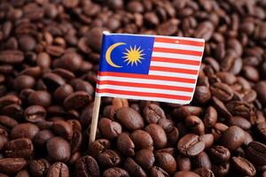 Malaysia flag on coffee beans, shopping online for export or import food product. photo