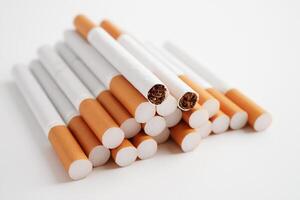 Cigarette, roll tobacco in paper with filter tube, No smoking concept. photo