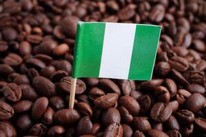 Nigeria flag on coffee beans, shopping online for export or import food product. photo