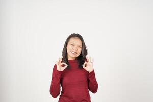 Young Asian woman in Red t-shirt smiling and showing okay sign isolated on white background photo