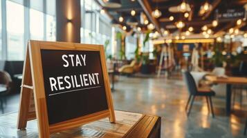 AI generated Motivational text  stay resilient  on blurred abstract background, success and inspiration concept photo