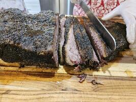 Smoked and seasoned beef brisket and wagyu meat sliced and served on a cutting board in Kirkland Washington photo