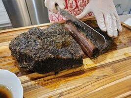 Smoked and seasoned beef brisket and wagyu meat sliced and served on a cutting board in Kirkland Washington photo