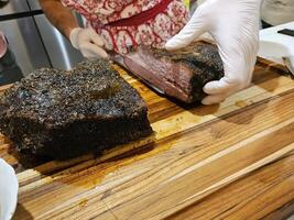 Smoked and seasoned beef brisket and wagyu meat sliced and served on a cutting board in Kirkland Washington photo