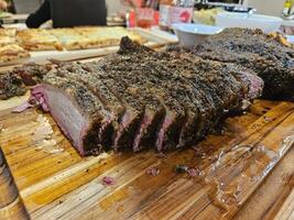 Smoked and seasoned beef brisket and wagyu meat sliced and served on a cutting board in Kirkland Washington photo