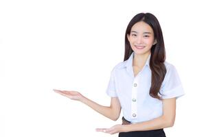 Portrait of adult Thai student. Beautiful Asian young woman student in university uniform is smiling and looking at camera to present confidently while isolated white background. photo