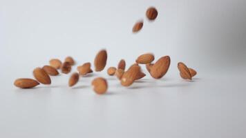 Slow motion nut almond on white background video