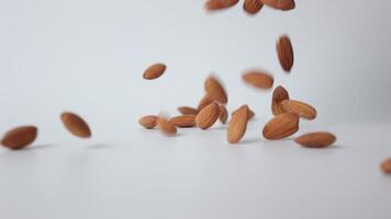 Slow motion nut almond on white background video