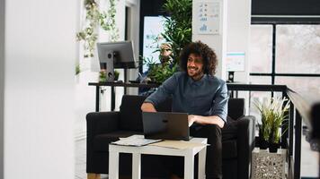 Agency worker examine statistics results on laptop, working in small business open space. Professional office employee brainstorming research project, AI developer waiting for client. photo