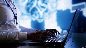 Admin writing artificial intelligence script code in cloud computing business establishment on laptop terminal. Tech savvy expert doing maintenance work in data center, upgrading AI systems photo