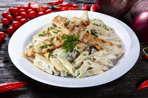 Pasta with roasted chicken steak photo