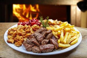 Snacks with fries, crackers, meat, pork, sausage photo