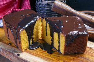 Carrot cake with chocolate syrup photo