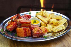 Pork ribs with fried cassava photo