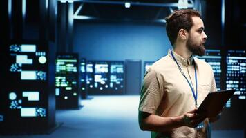 IT specialist in server room ensuring valuable data remains secure from potential threats, safeguarding against unauthorized access and vulnerabilities, securing system from DDoS attacks photo