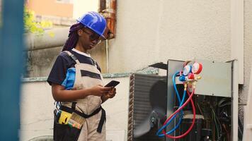 Precise technician apprentice asking master for advice over the phone about out of order air conditioner internal components. Mechanic calling expert to inform him of needed condenser repairments photo