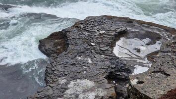 Huge water stream running down hills forming beautiful scenic route in nordic region, icelandic scenery with waterfall. Majestic scandinavian cliffs in Iceland, natural Gullfoss cascade. photo