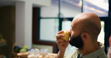 Vendor gives fresh lemons to client to smell and enjoy organic natural citrus scent, buying locally grown fruits from eco store. Adult supporting local farming small business. photo