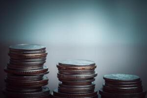 Stack of coins with filter effect retro vintage style and shallow depth of field photo