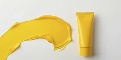 AI generated Soothing Care, Yellow Hand Cream Tube Packaging Presented Against a Clean White Background photo