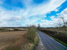 Aerial View of British Countryside and Agricultural Farm Land at Village of England UK. March 1st, 2024 photo