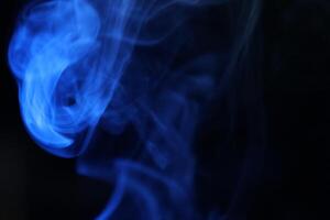 Purple smoke on a dark background, fog pattern, detailed smoke shapes photo