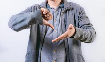 Unrecognizable person talking in sign language isolated. Interpreter gesturing in sign language isolated photo