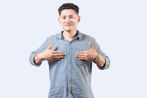 Interpreter person gesturing HAPPINESS in sign language. Smiling young man gesturing HAPPINESS in sign language photo