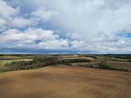 Aerial View of British Countryside and Agricultural Farm Land at Village of England UK. March 1st, 2024 photo