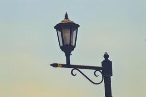 an antique and classic garden lamp in the shape of a lantern photo