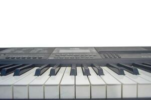 digital piano on a plain white wall background photo