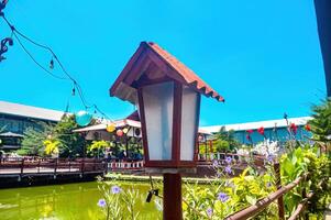 an antique Japanese-style garden lamp in a restaurant garden photo