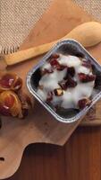 Appetizer with date pudding and some chopped dates topped with vanilla sauce video
