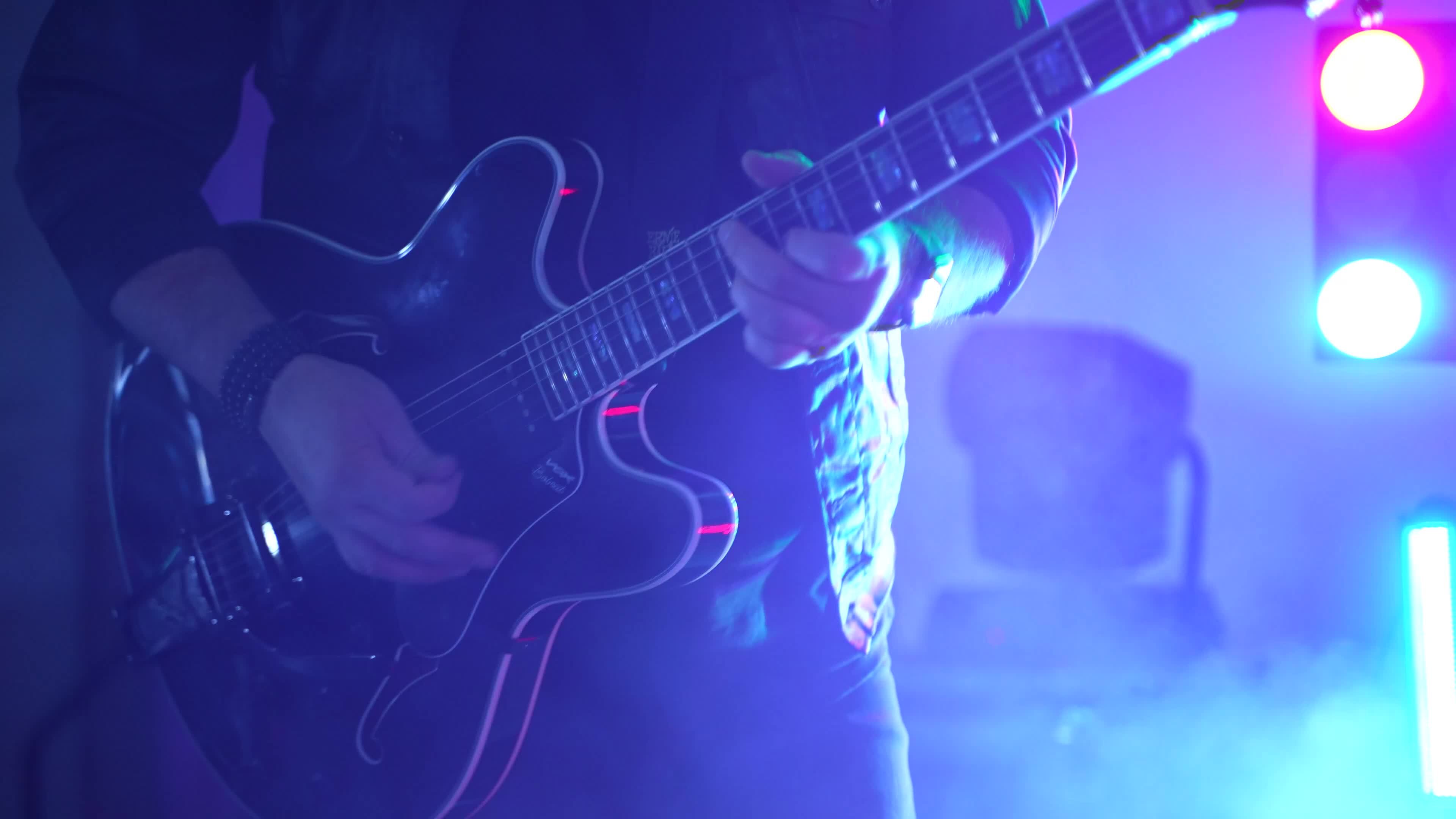 Rock Guitarist Shreds Electric Guitar On Concert Stage Dynamic Rock Guitarist Shreds Electric Guitar On Concert Stage Dynamic