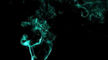 Smoke with fluorescent particles on black 4K background video