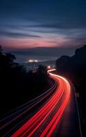 AI generated Highway in the mountains at night with motion blur and blue sky photo